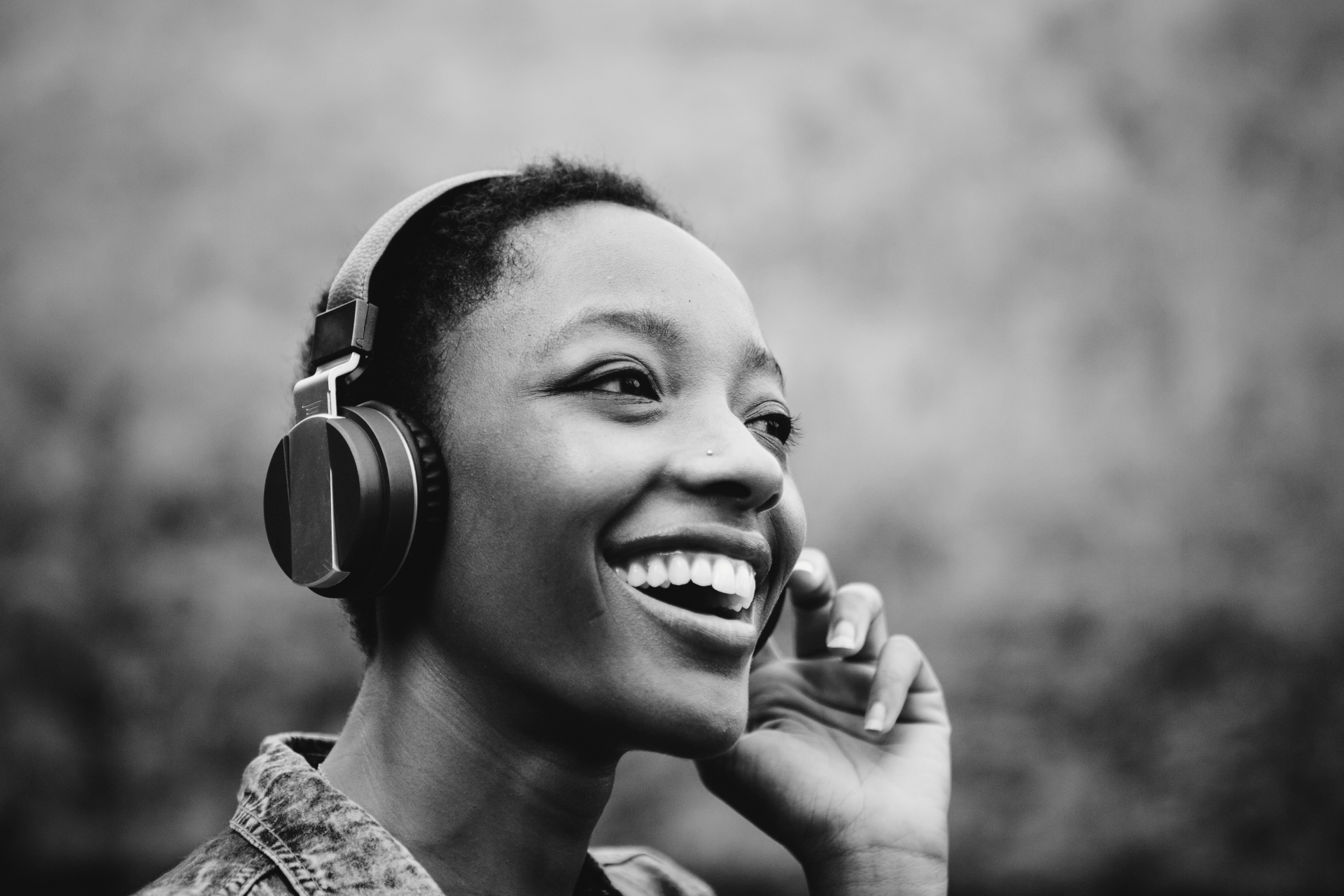 Third Culture Africans podcast woman listening to podcast on headphones